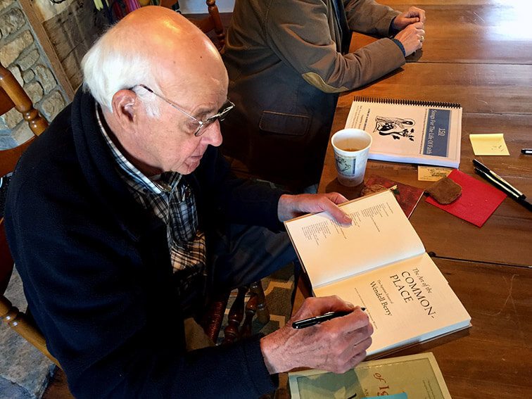 Wendell signing book