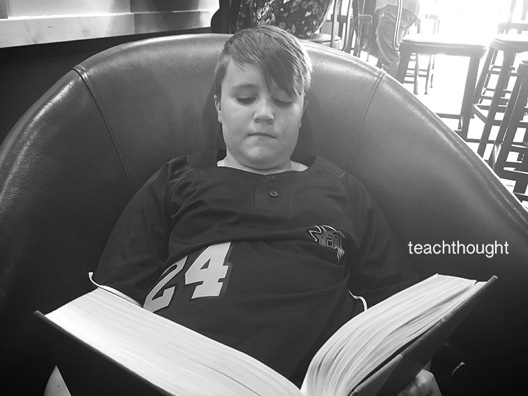 student reading in chair